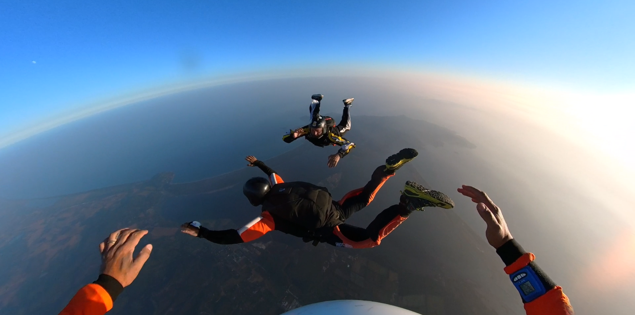 Skydivers flying in formation in freefall