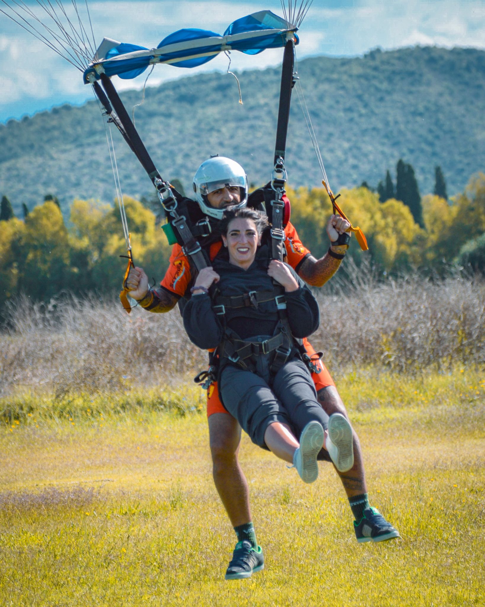 Landing under an open parachute