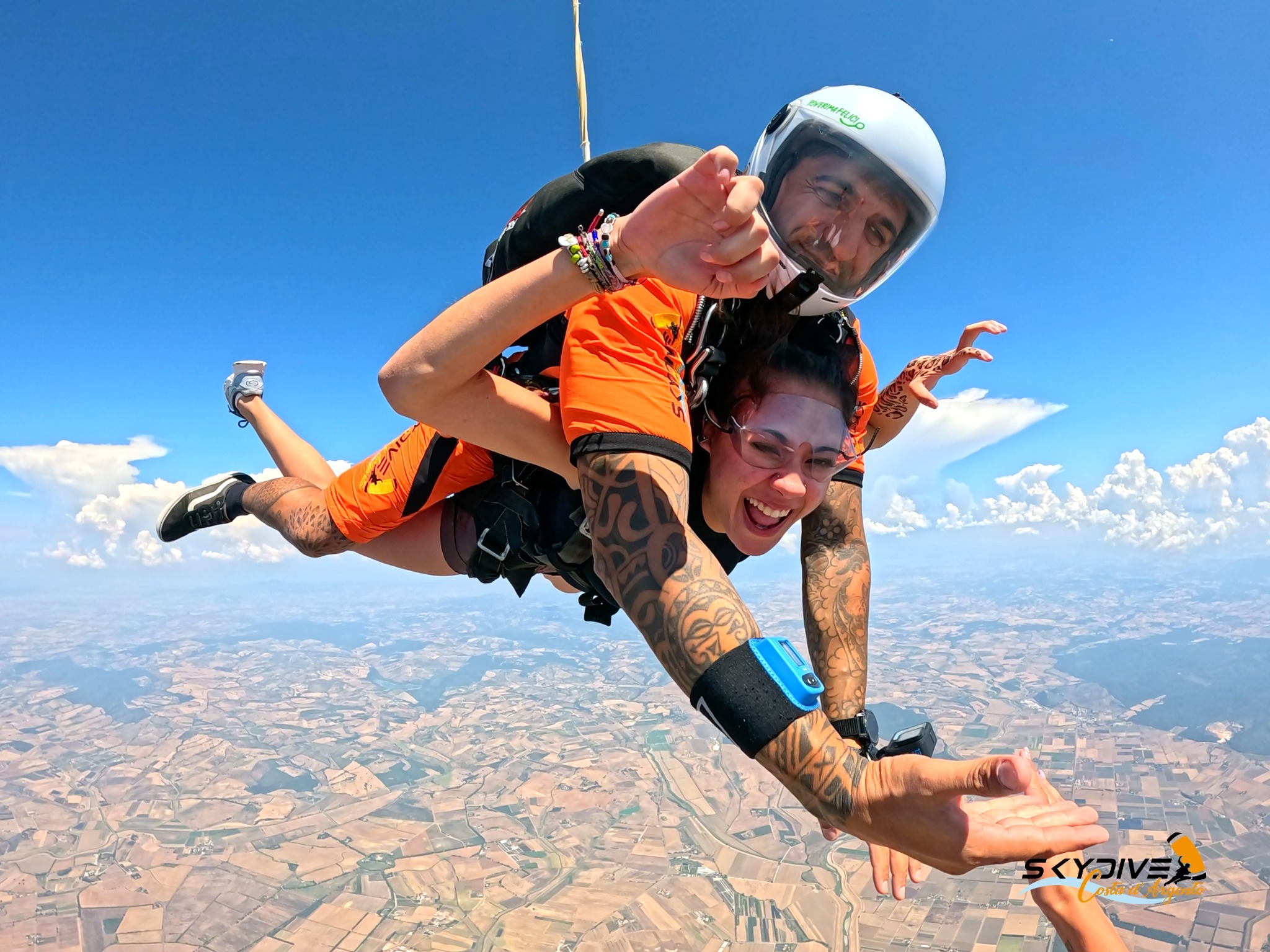 Tandem skydiving in a blue sky